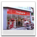 Triumph - Kombination Edelstahlobjekt Ganzglasanlage. Aluminiumblende in Übergröße auf über 6m Länge.